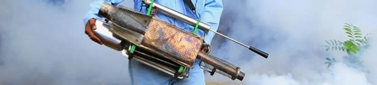 Fumigation technician using a fogger for deep pest treatment in Columbia, SC